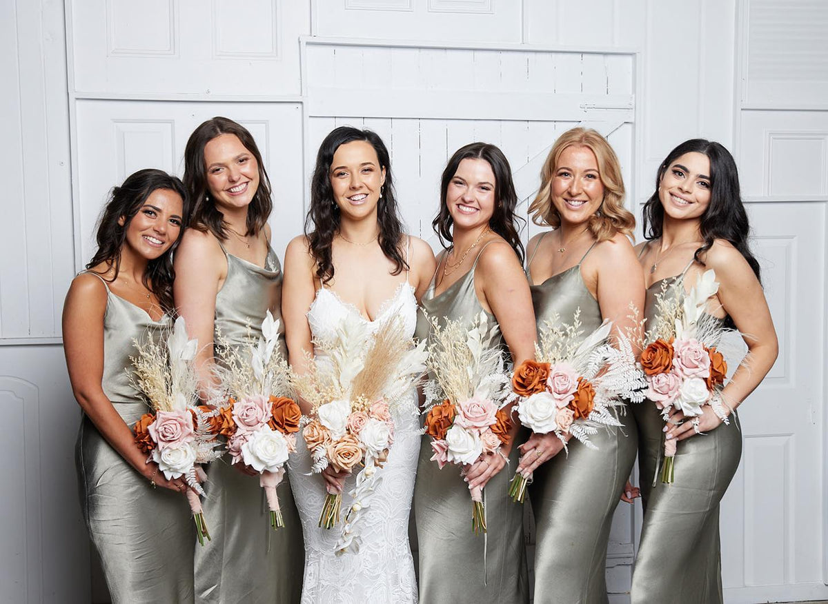Dried bridesmaid bouquets in soft pink, ivory and rust tones